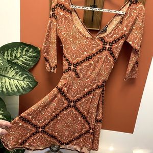 rust/terracotta skater dress with cut out back